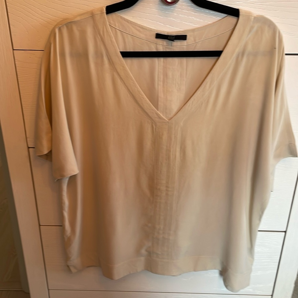 Tibi beige silk short sleeve v neck  top. Decorative panel along front